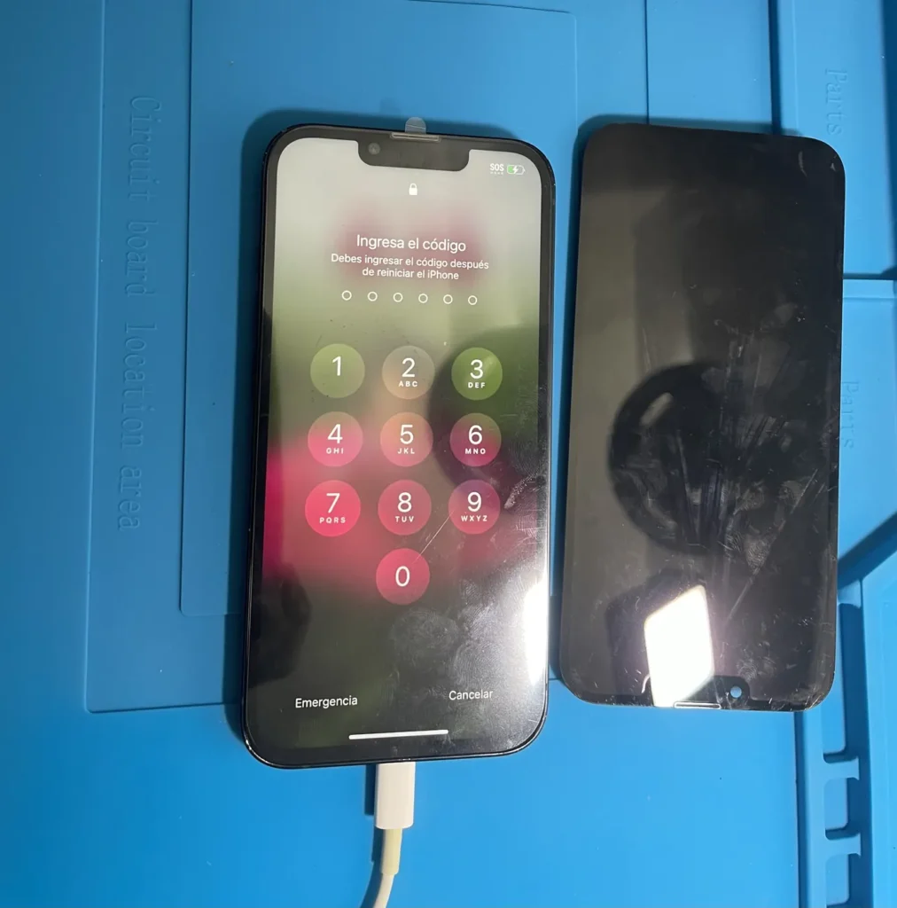 Two iPhones on the YAS TECH repair bench during a screen repair