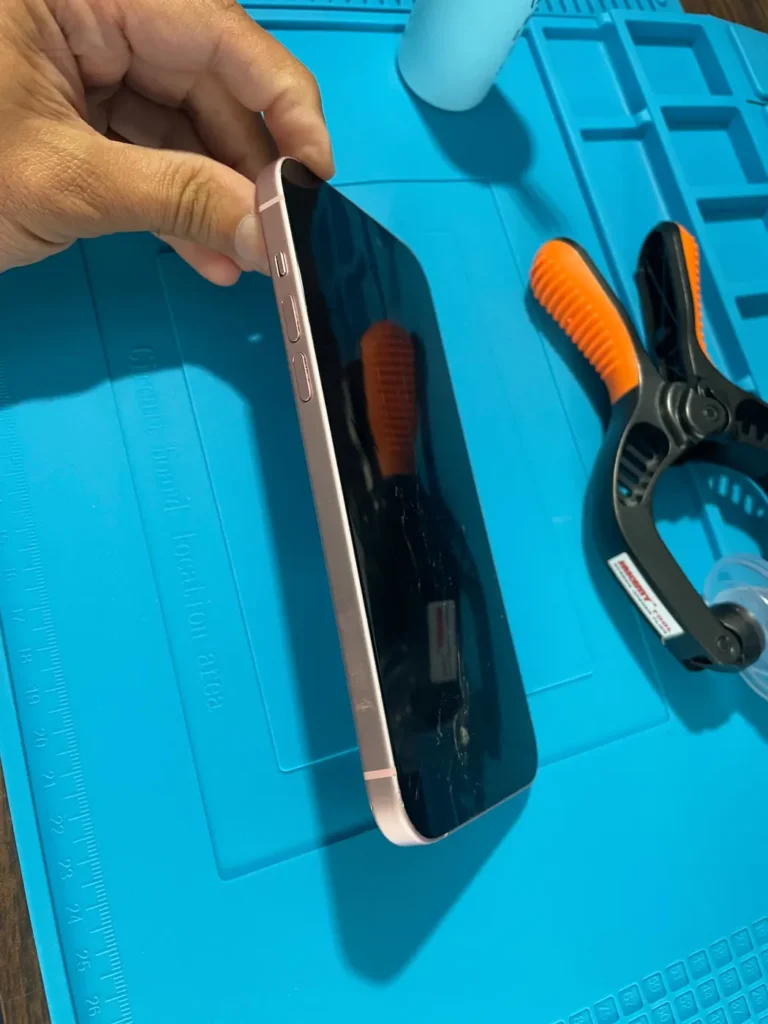Phone held in a clamp while the frame is opened